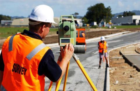 Man surveying in the street