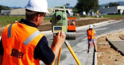 Man surveying in the street