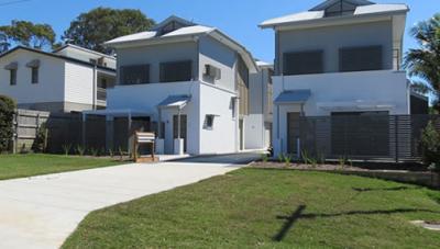 Modern townhouse development with multiple dwellings, surveyed for strata title subdivision and registration of individual property lots